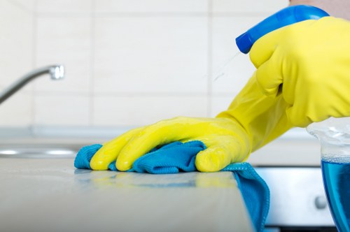 Technician performing deep carpet cleaning in a Burnley home